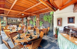 Breakfast, lunch, dinner served; local cuisine, pool views