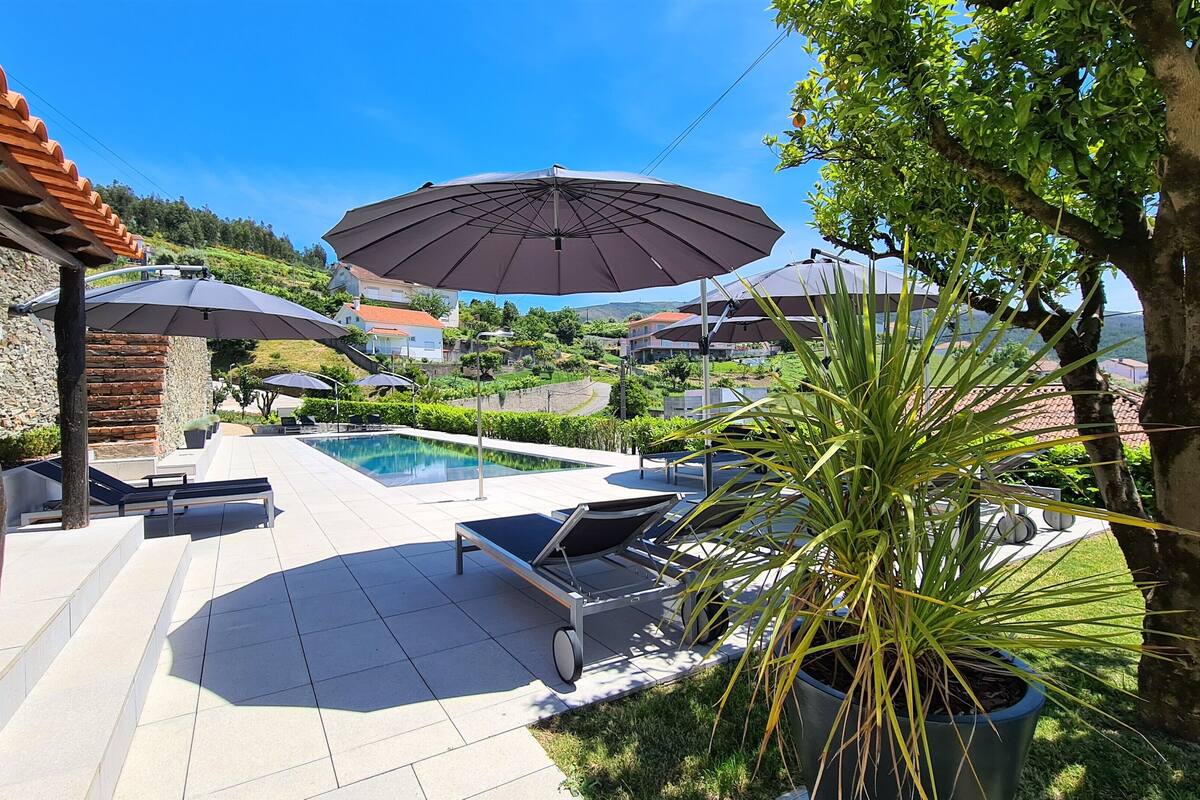 outdoor pool, pool umbrellas, pool loungers