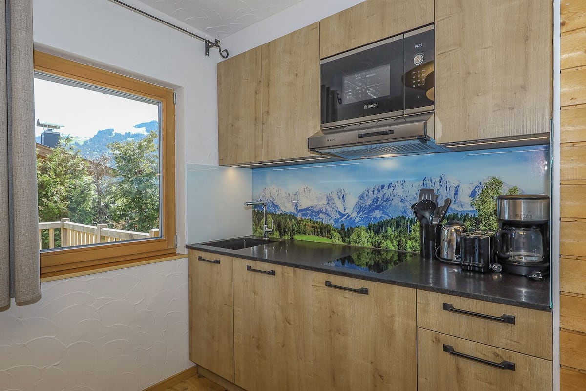 deluxe apartment, mountain view, garden area (or bungalow) | private kitchen