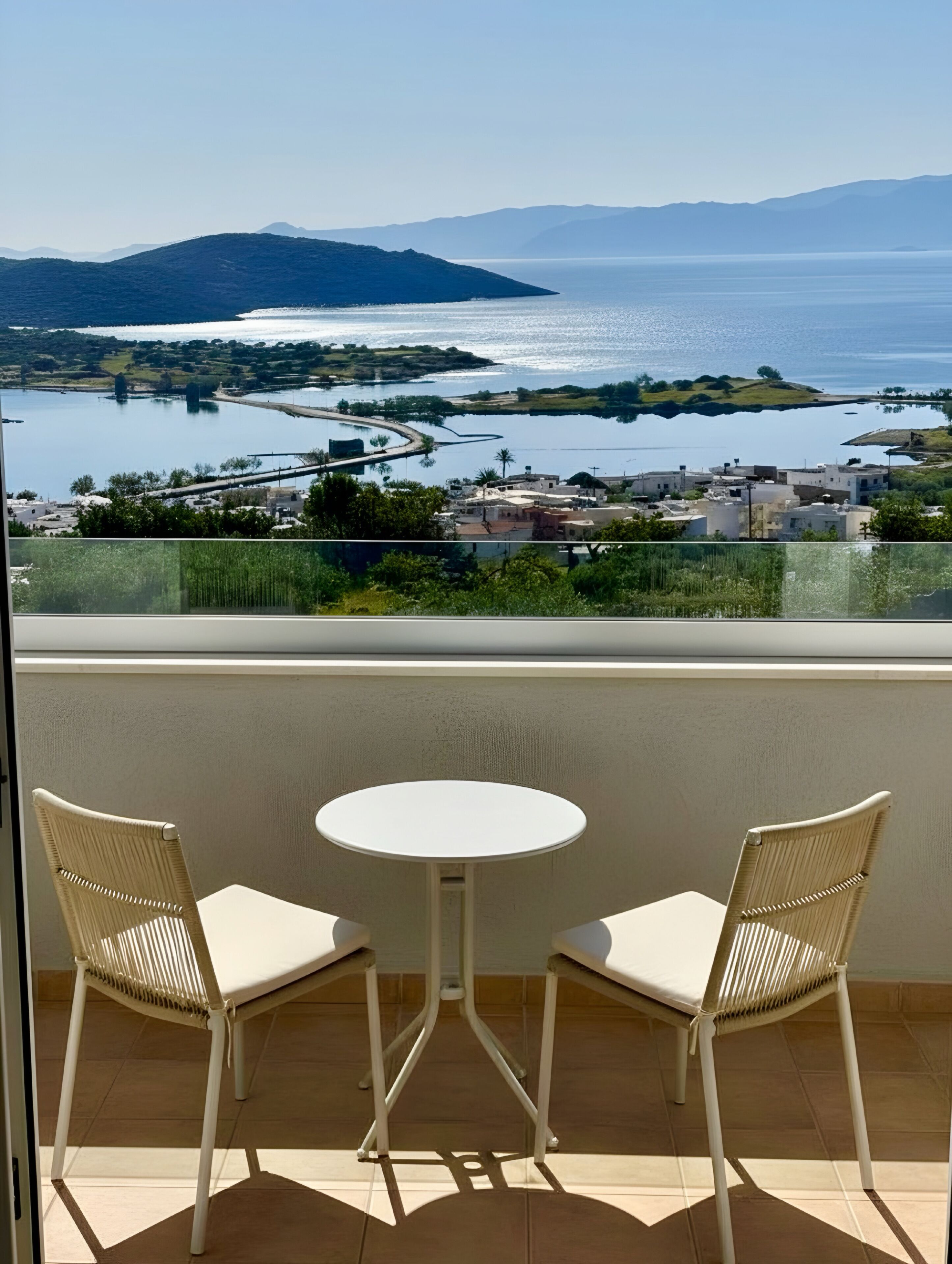 Deluxe Suite with Panoramic Sea view and Shared pool | Terrace/patio