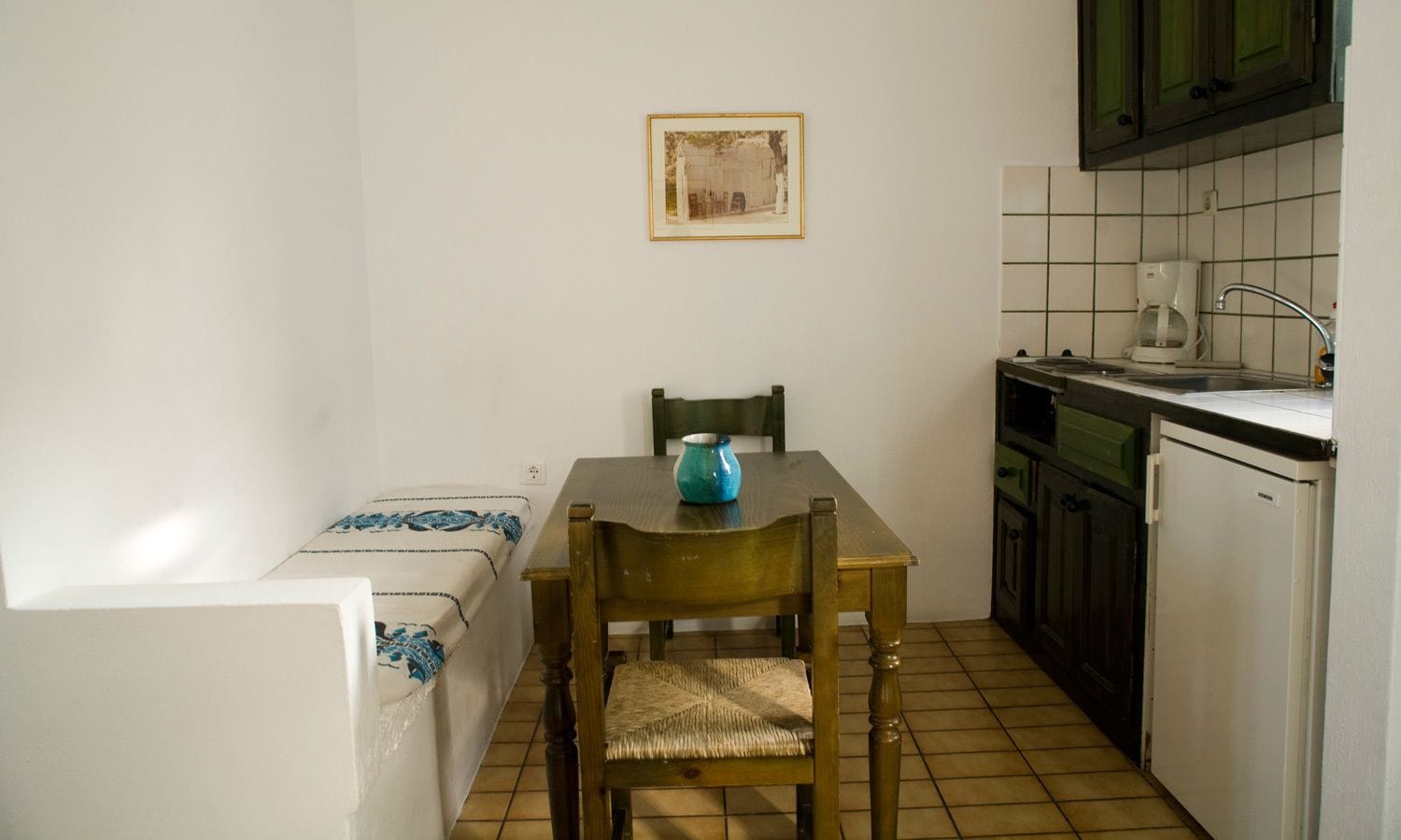 fridge, coffee/tea maker, electric kettle, cookware/dishes/utensils