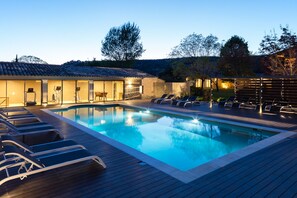 Seasonal outdoor pool, open 8:00 AM to 9:00 PM, pool umbrellas