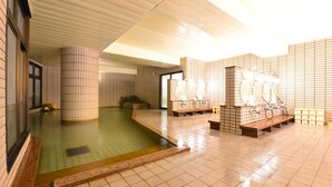 A clean, tiled indoor pool area with benches and a changing room. - Shiga Lake Hotel (Yamanouchi)