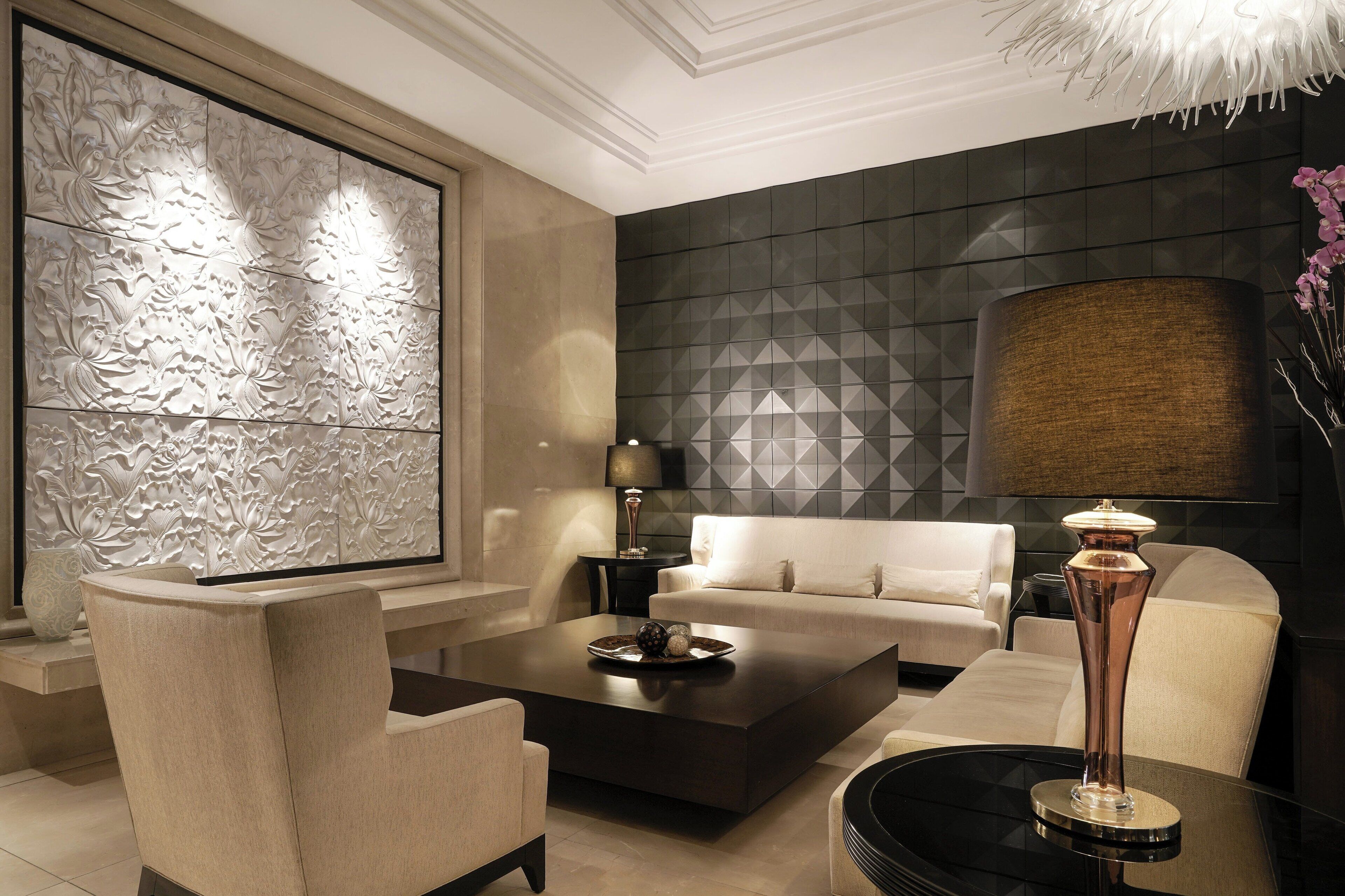 A modern living room with a sofa, coffee table, and decorative lamp.