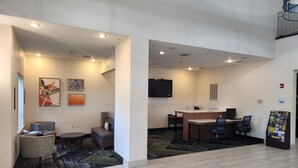 A hotel lobby with a reception desk, seating area, and a business center. - Holiday Inn Express Heber Springs by IHG (Heber Springs)