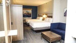 A hotel room with a bed, a sofa, a desk, and a wardrobe. - Holiday Inn Express Hotel & Suites Donegal by IHG (Stahlstown)