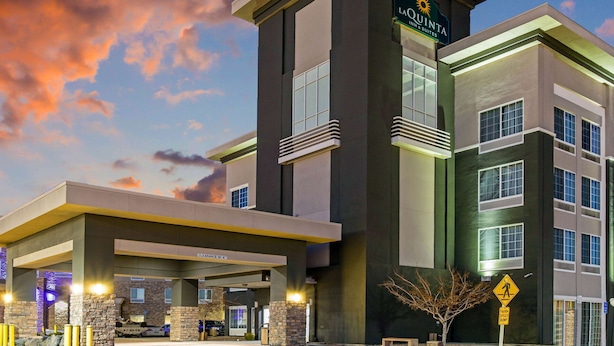 A hotel with a modern design, featuring a prominent sign for La Quinta Inn & Suites. - La Quinta Inn & Suites by Wyndham Denver Gateway Park (Denver)