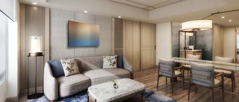 A modern living room with a sectional sofa, a dining table with chairs, a coffee table, and a large mirror.