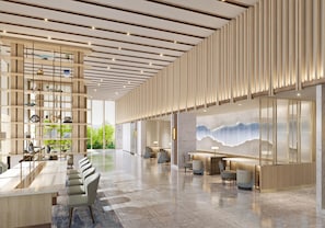 A spacious lobby with a high ceiling, modern furniture, and a large wall mural. - Courtyard by Marriott Kyoto Station (Kyoto)