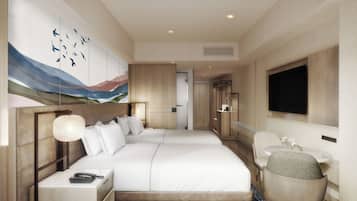 A modern hotel room with a large bed, bedside tables, a desk, a chair, a flat-screen TV, and artwork on the wall.