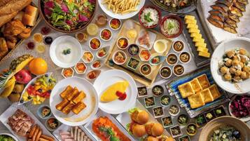 A variety of food items including salads, bread, and meats, suggesting a buffet-style meal.