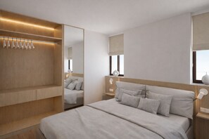 A modern bedroom with a large bed, built-in wardrobe, and bedside lamps.