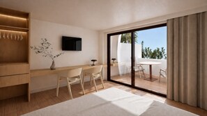 A modern bedroom with a large bed, a desk with chairs, a TV, and a sliding glass door to a balcony. - Aparthotel Playa del Sol - Adults Only (San Bartolomé de Tirajana)