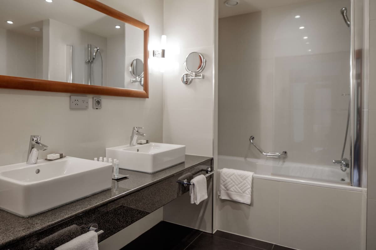 combined shower/bathtub, deep-soaking bathtub, rainfall showerhead