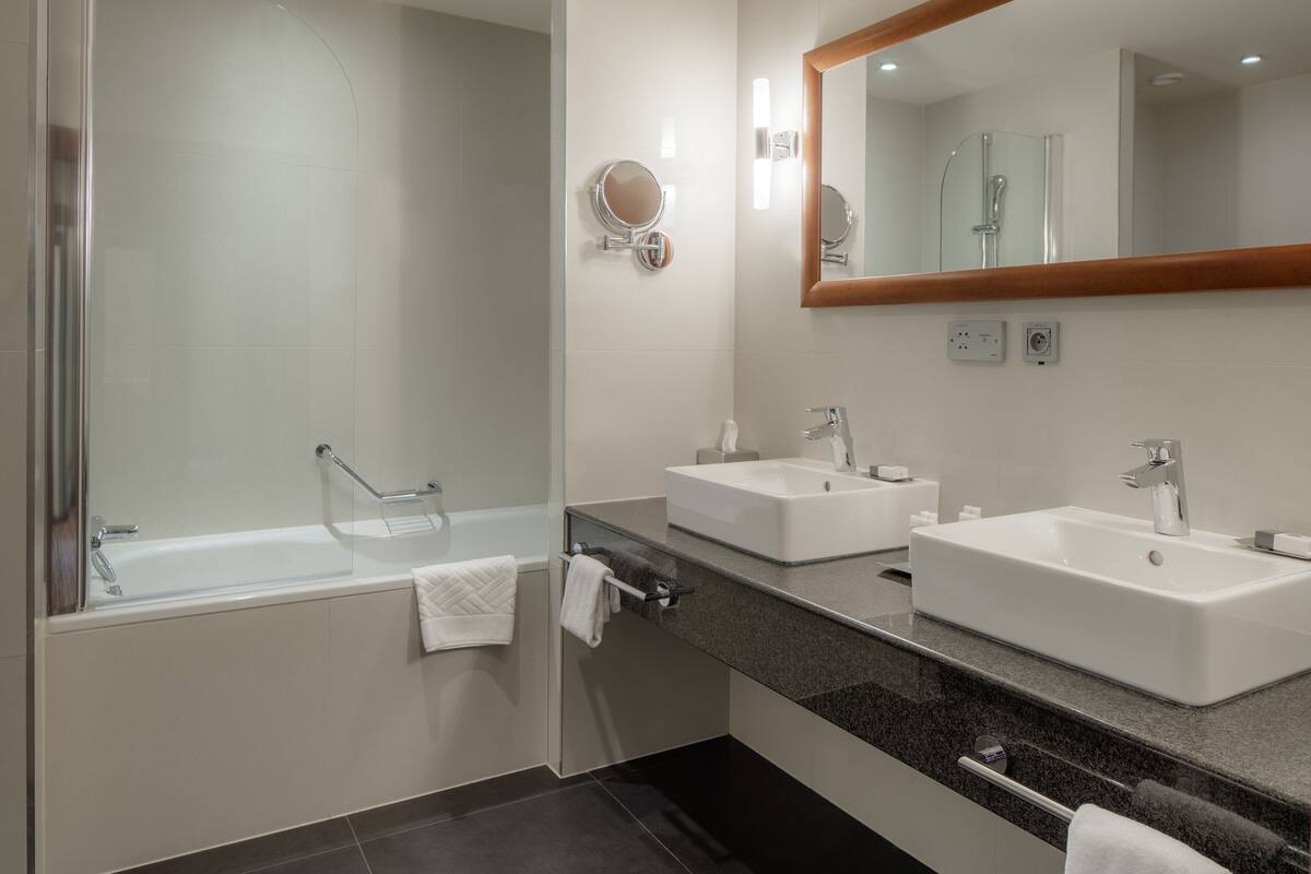 combined shower/bathtub, deep-soaking bathtub, rainfall showerhead