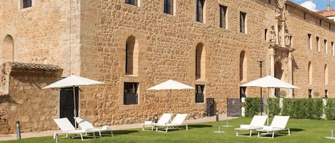 Indoor pool, seasonal outdoor pool, pool umbrellas, pool loungers