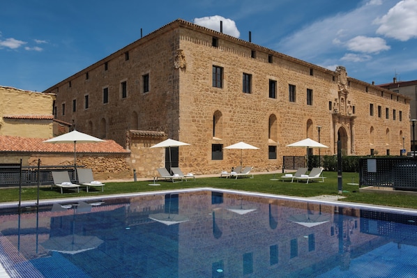 Indoor pool, seasonal outdoor pool, pool umbrellas, pool loungers