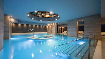 Indoor pool, seasonal outdoor pool, pool umbrellas, pool loungers