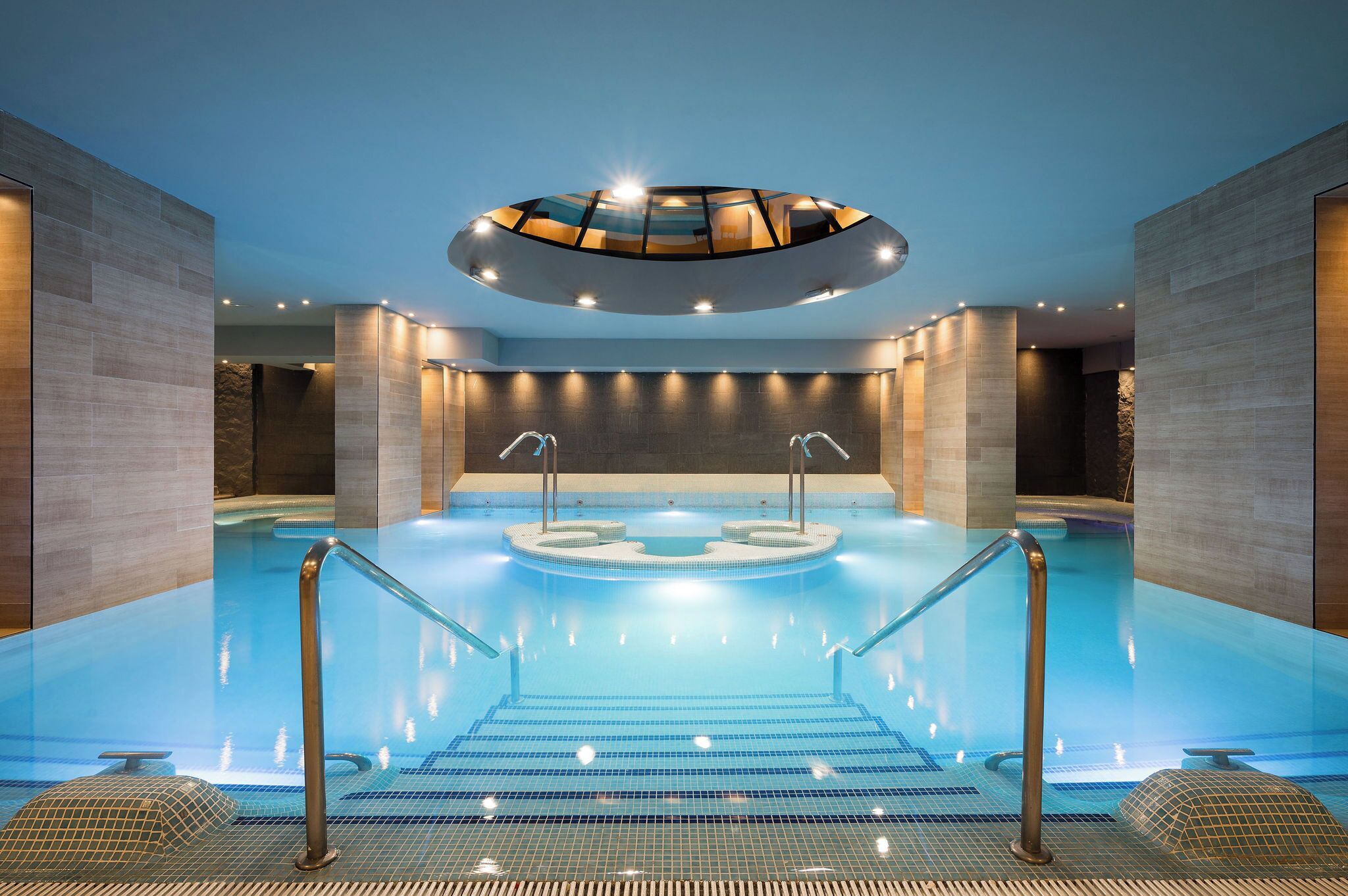 indoor pool, seasonal outdoor pool, pool umbrellas, pool loungers