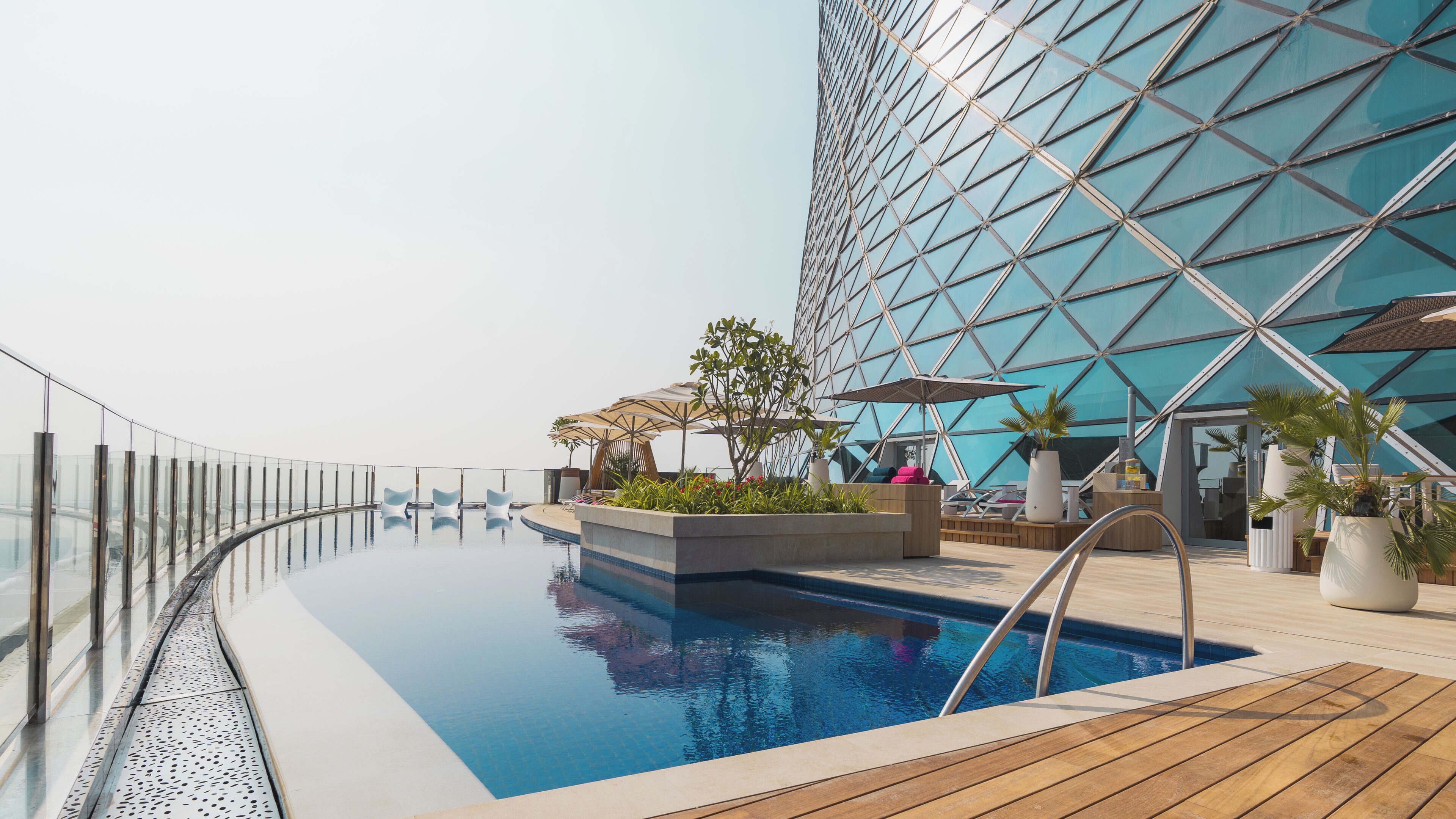 Outdoor pool, pool umbrellas, sun loungers