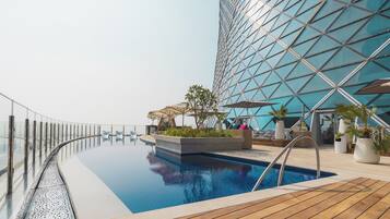 Outdoor pool, pool umbrellas, sun loungers