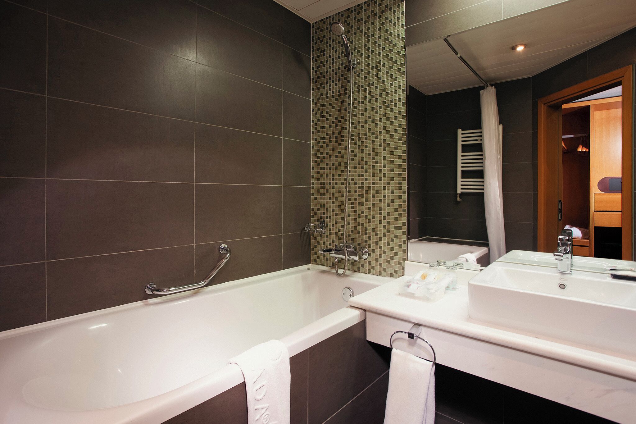 combined shower/bathtub, deep-soaking bathtub, hair dryer, bathrobes