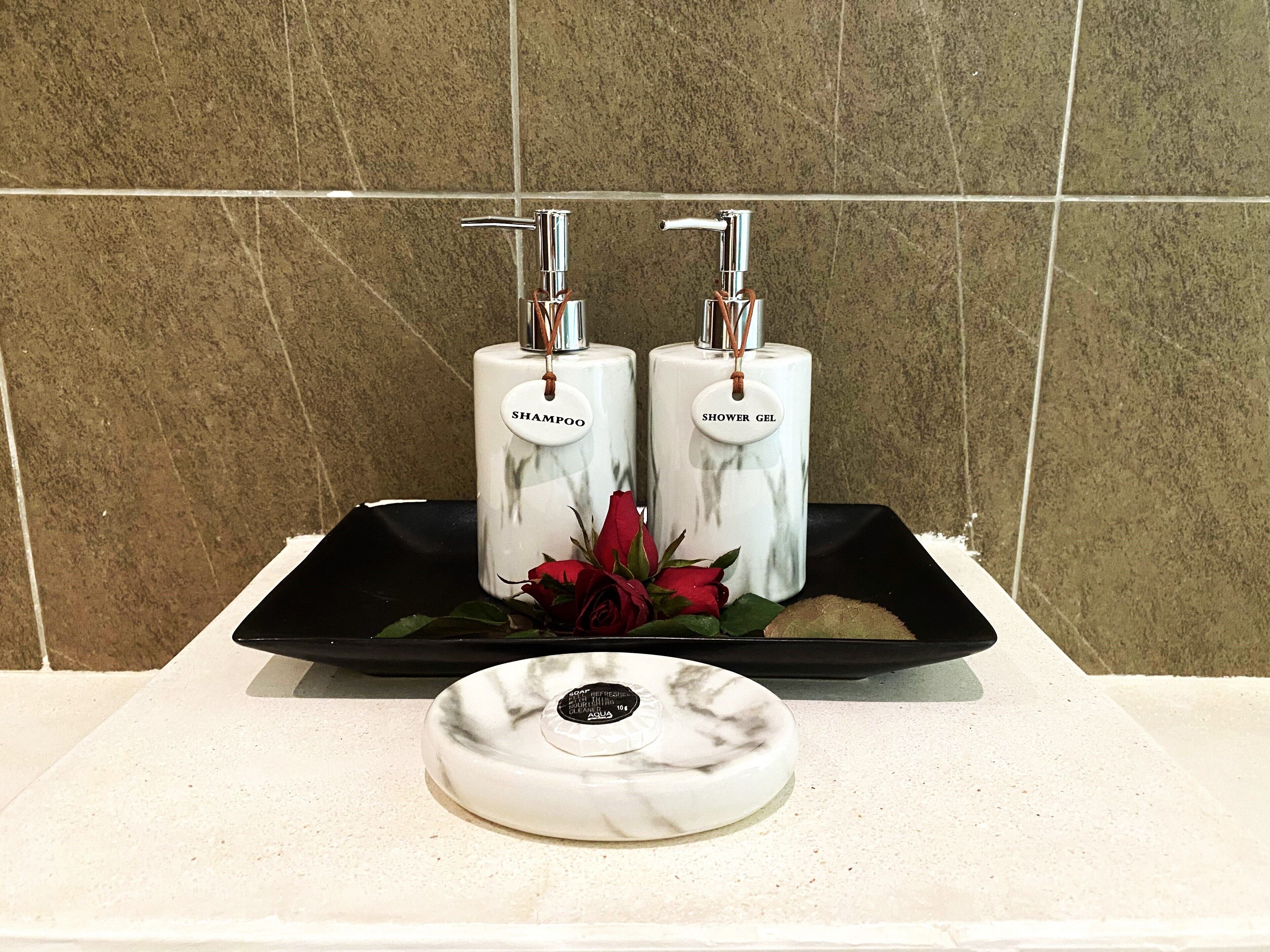 executive deluxe room with pool view | bathroom | separate bathtub and shower, rainfall showerhead, free toiletries