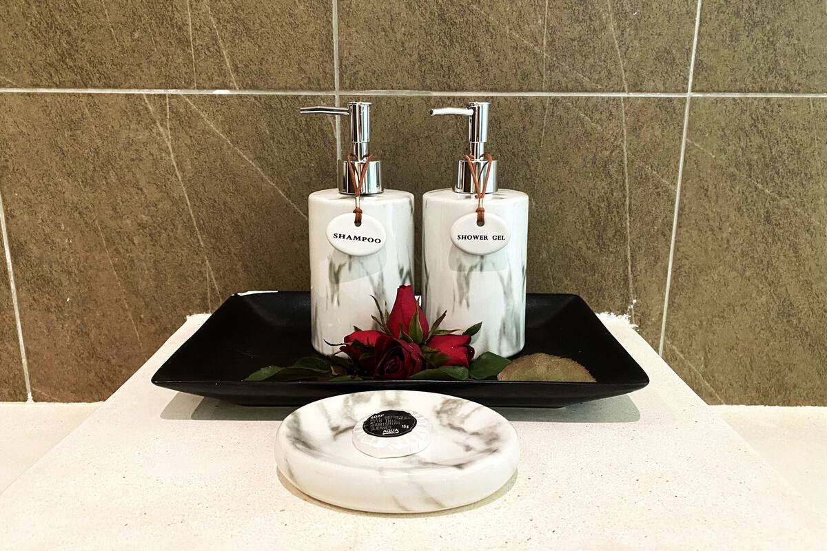 executive deluxe room with pool view | bathroom | separate bathtub and shower, rainfall showerhead, free toiletries