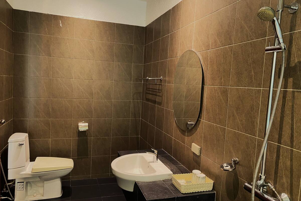 executive deluxe room with pool view | bathroom | separate bathtub and shower, rainfall showerhead, free toiletries