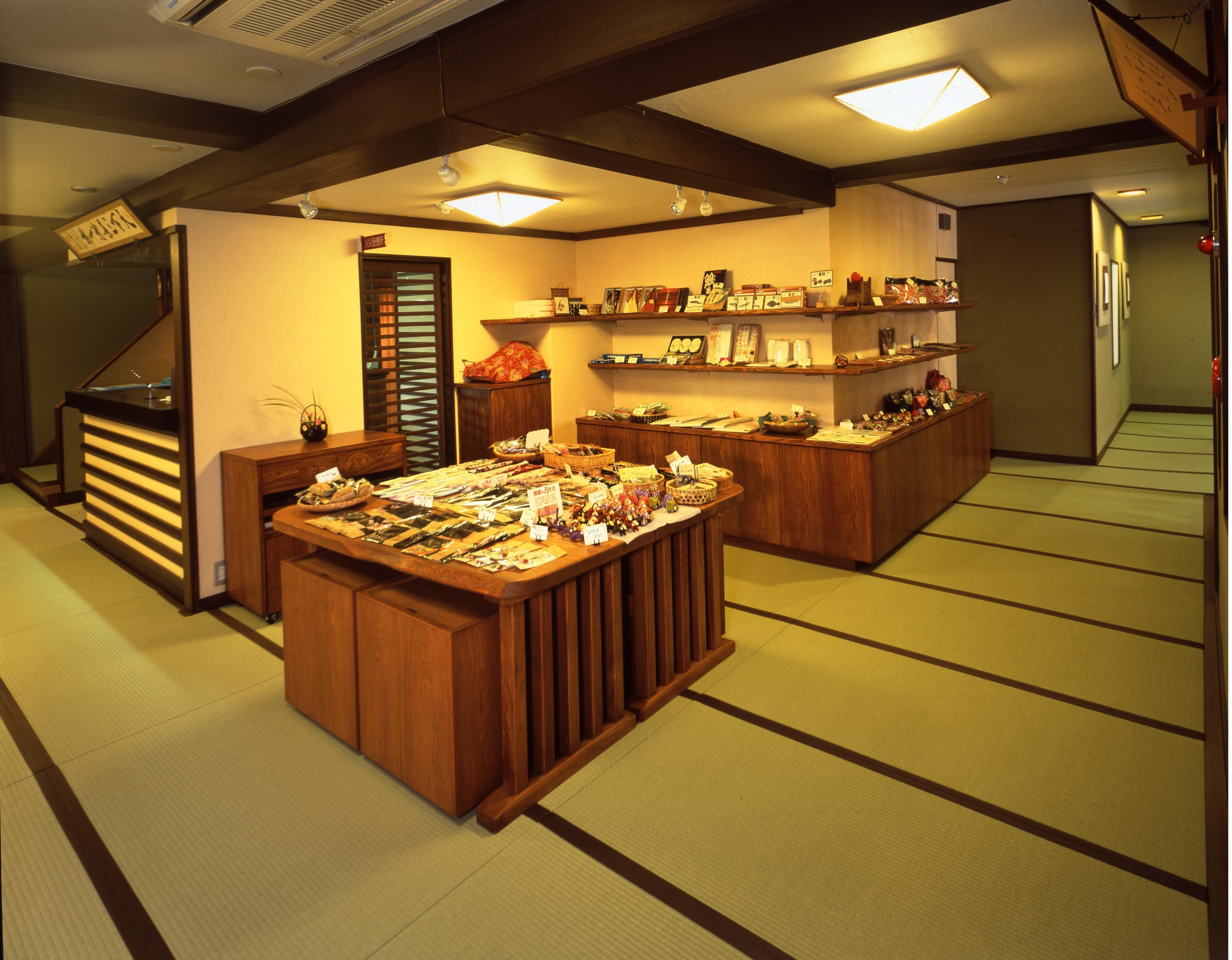 A traditional Japanese store with wooden counters displaying various items.