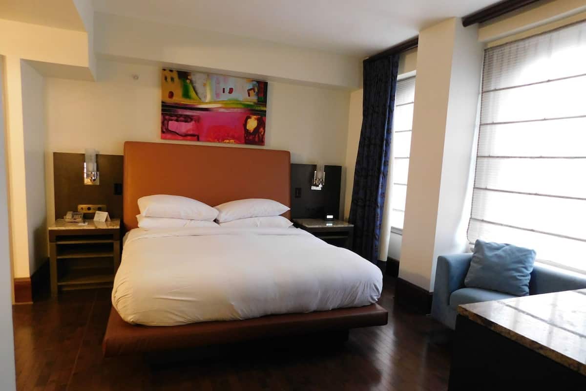 Hypo-allergenic bedding, down duvets, in-room safe