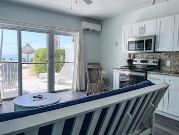 Oceanfront King Suite w/ Beach Walkout & Kitchen | Private kitchen | Coffee/tea maker at Drop Anchor