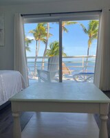 Oceanfront King Suite w/ Kitchen & Private Balcony | Premium bedding, individually decorated, individually furnished