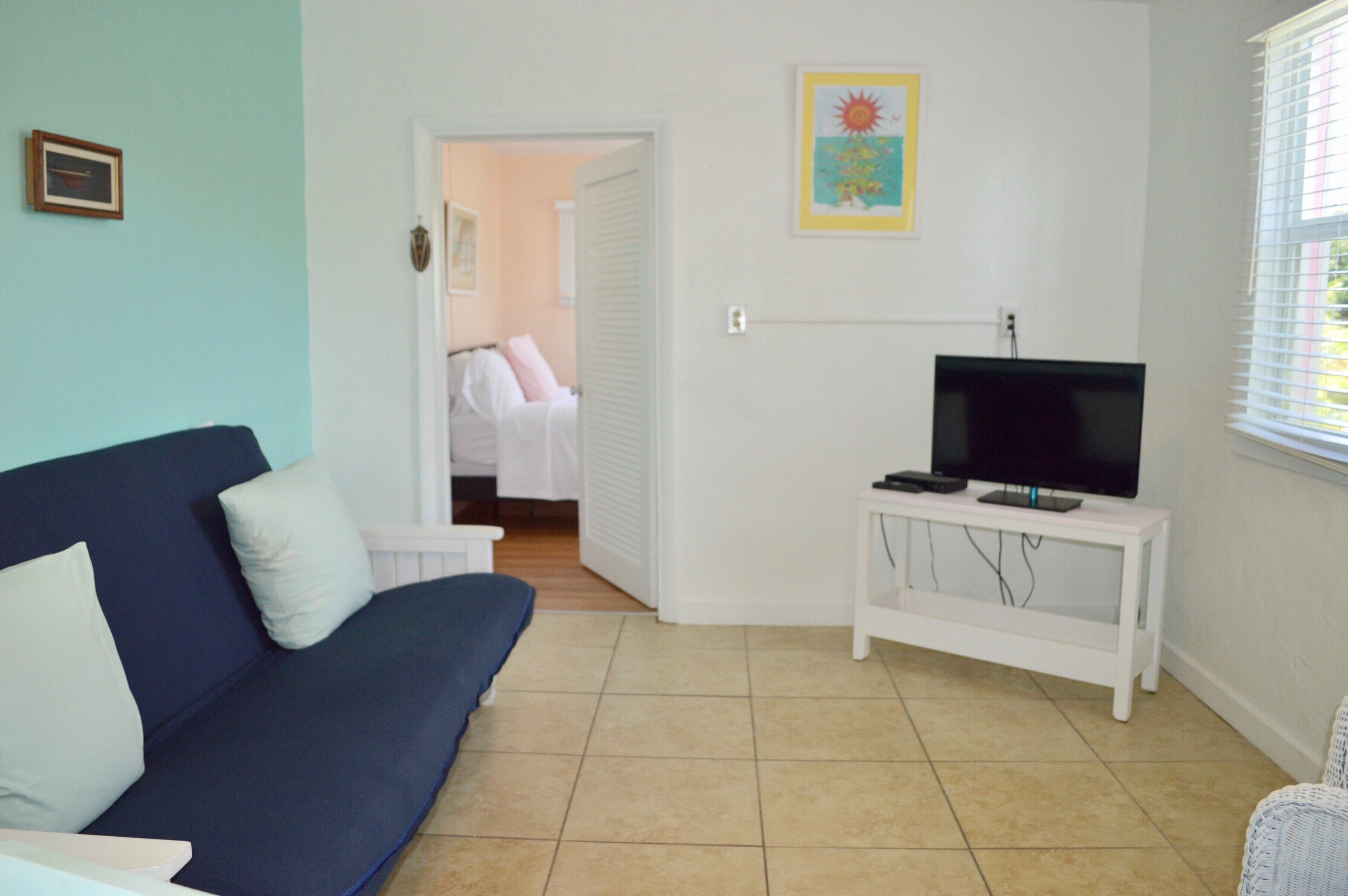 resort view family suite w/ kitchen | living area | flat-screen tv