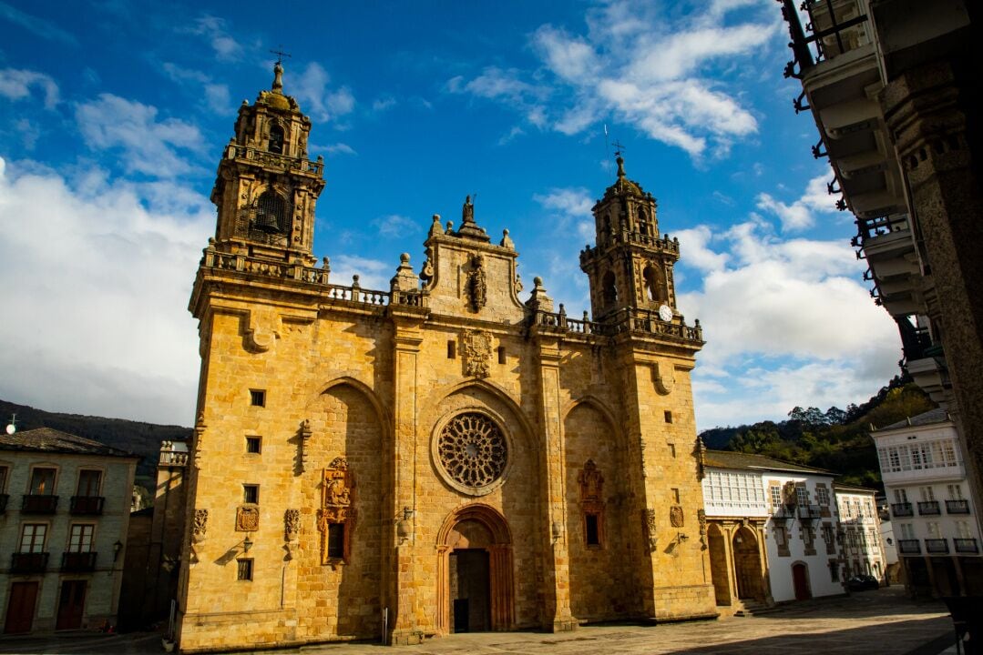 A historic church with two bell towers and a large central dome.