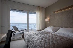 Deluxe Room, Sea Facing (Beach Access Included) | Minibar, in-room safe, desk, laptop workspace