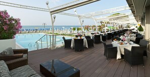 Lunch, dinner served; international cuisine, beach views