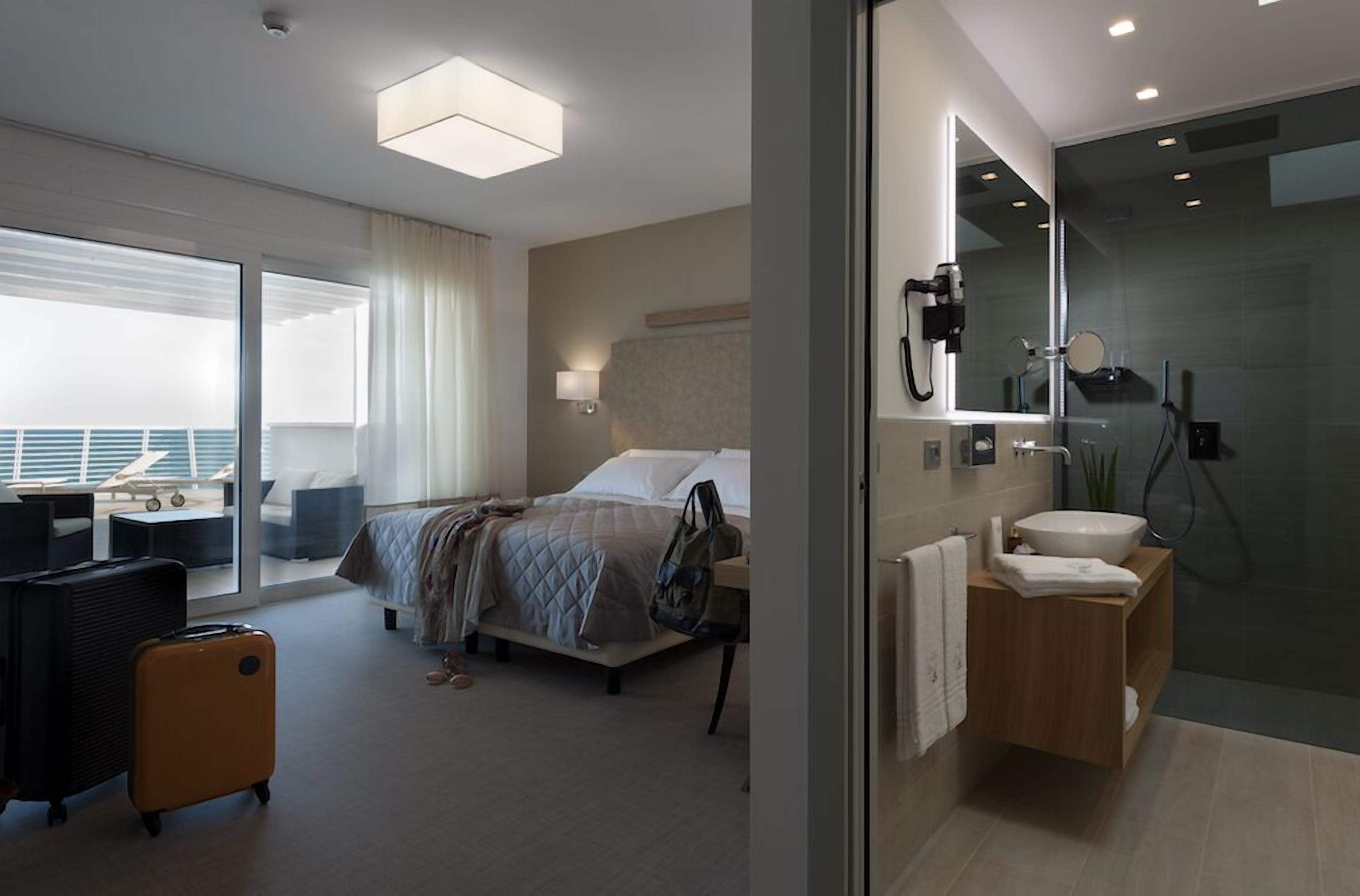 panoramic suite, sea view (beach access included) | 1 bedroom, minibar, in-room safe, desk