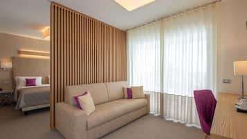 Premier Room, Hot Tub, Partial Sea View | Minibar, in-room safe, desk, laptop workspace