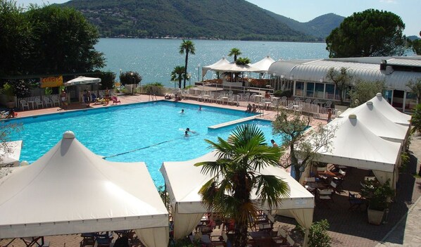 2 outdoor pools, open 9:30 AM to 7:30 PM, pool umbrellas, pool loungers