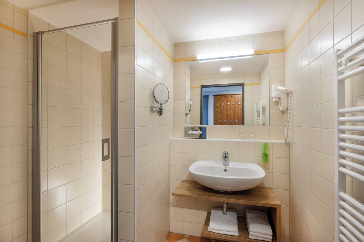 shower, hair dryer, towels, soap