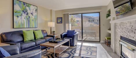 Premium Condo, 2 Bedrooms | Living area | 34-inch TV with cable channels, fireplace