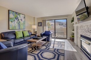 Premium Condo, 2 Bedrooms | Living area | 34-inch TV with cable channels, fireplace
