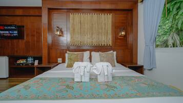Family Room, Garden View | 1 bedroom, minibar, blackout curtains, iron/ironing board