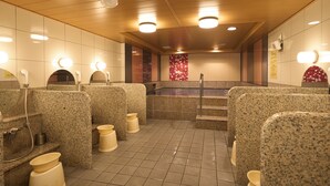 A public restroom with granite counters, a hot tub, and a tiled floor. - Hotel Hokke Club Fukuoka (Fukuoka)