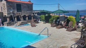 Seasonal outdoor pool, pool loungers