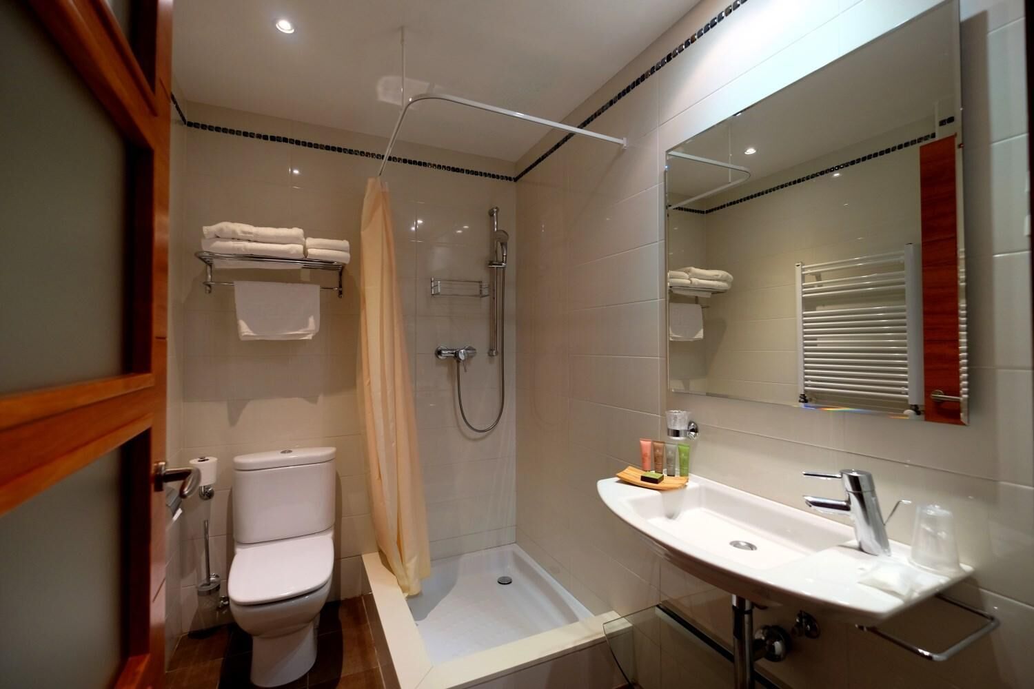 designer toiletries, hair dryer, towels