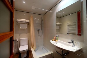 Designer toiletries, hair dryer, towels