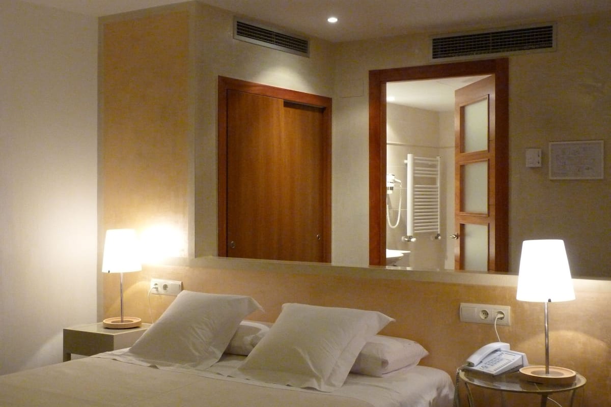 superior double room, 1 double bed, balcony, city view | premium bedding, minibar, in-room safe, individually decorated