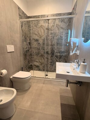 Standard Room, Private Bathroom | Bathroom | Shower, free toiletries, hair dryer, bidet